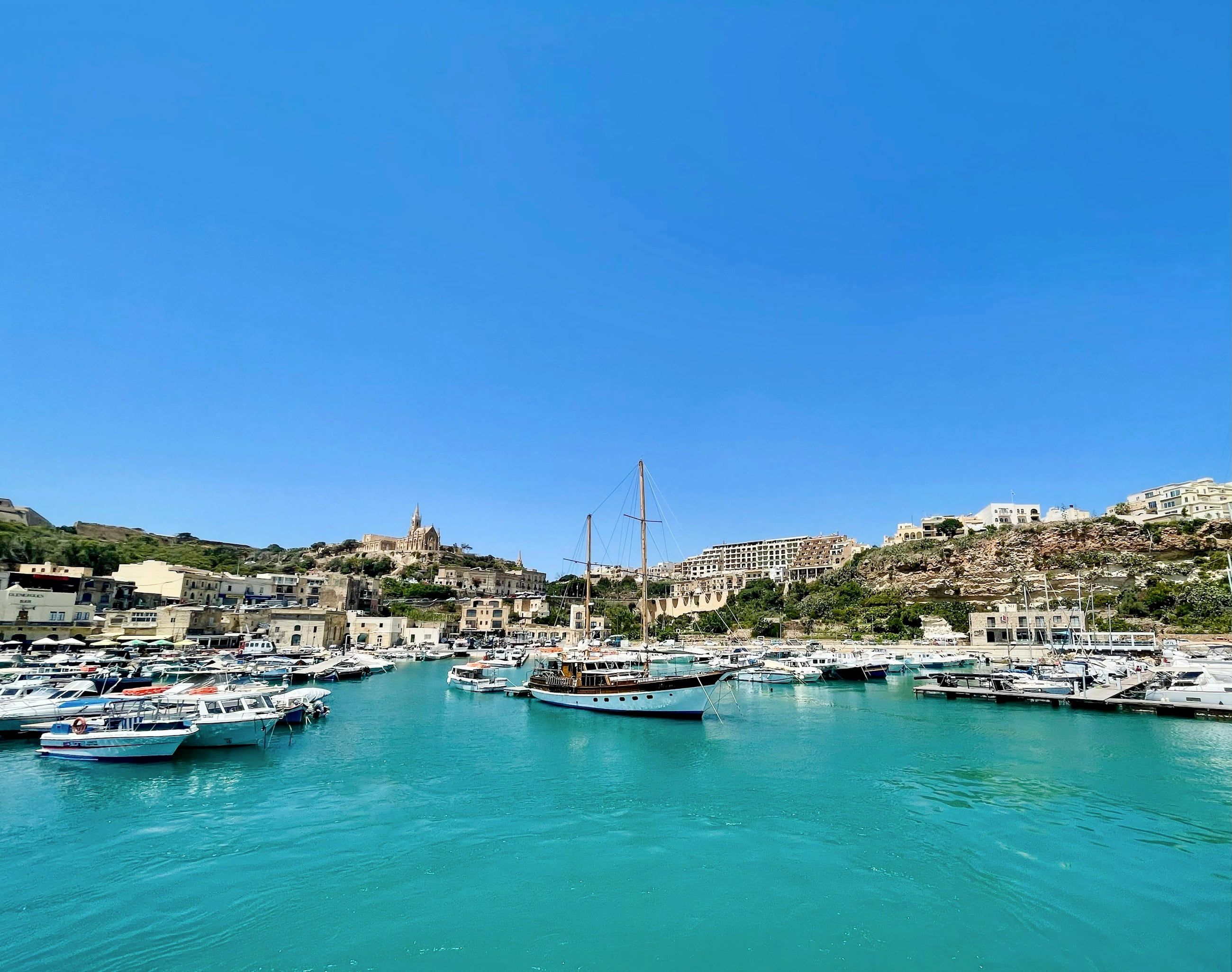 Mġarr harbour on Gozo with the church on the hill above