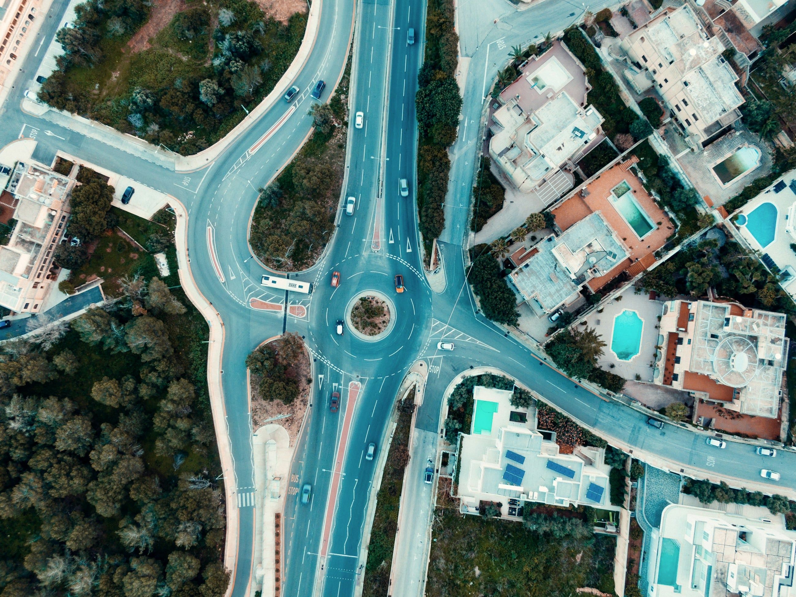 A Maltese roundabout seen from directly above, cars circling clockwise